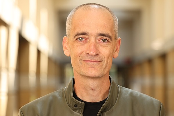 Portrait photograph of Norbert Koppensteiner smiling